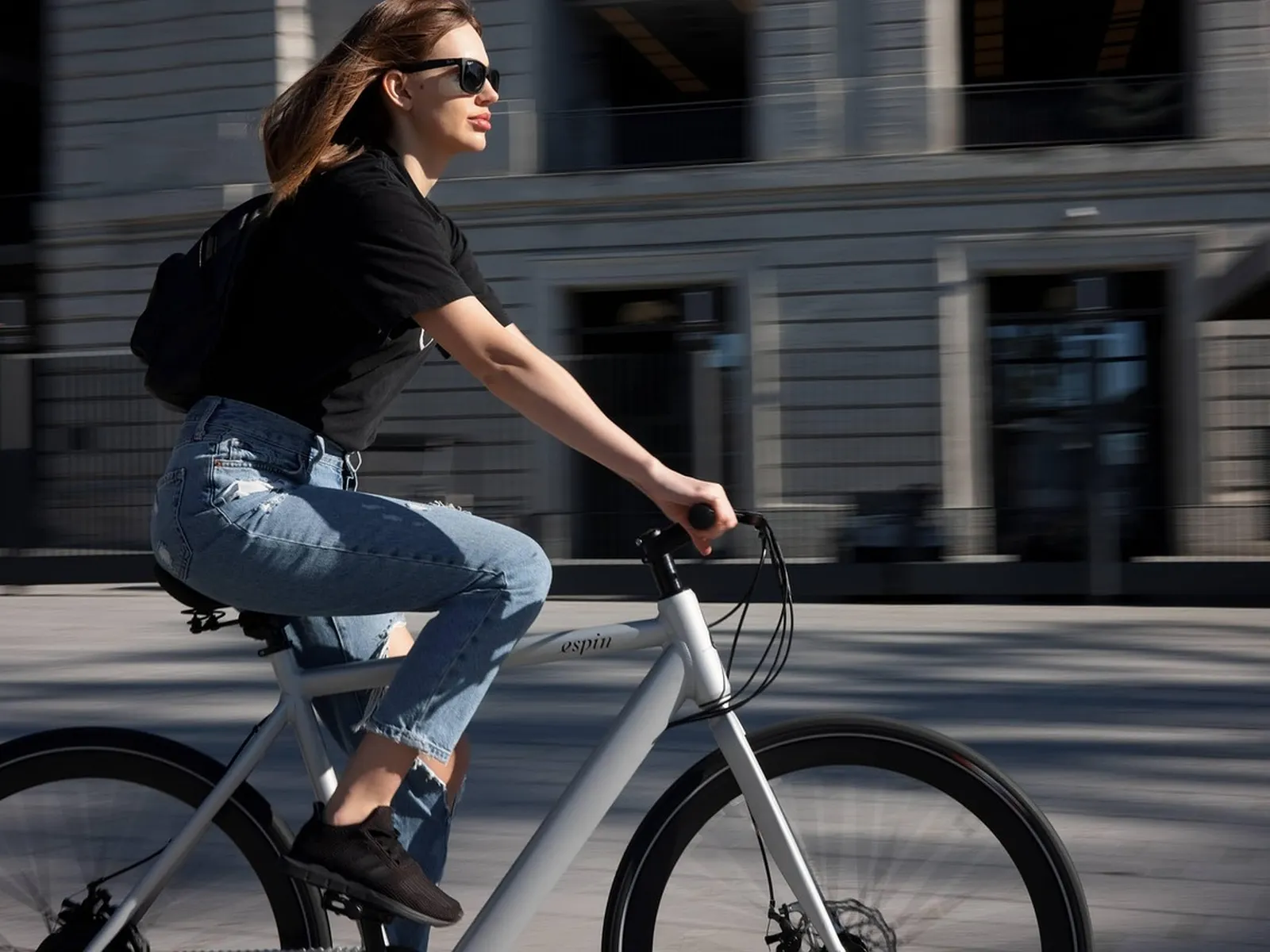 Cyclist riding a bike along a city street