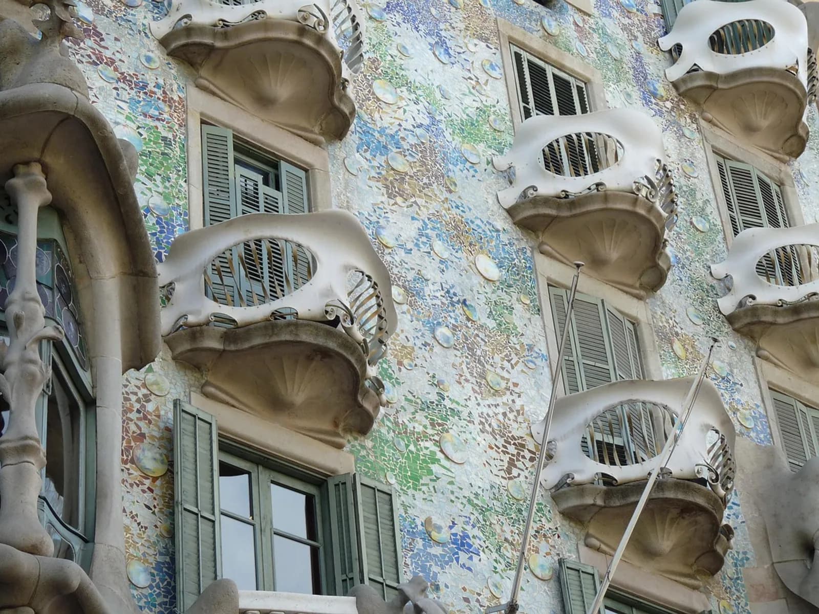 Casa Batlló rooftop at night with live music and Barcelona views