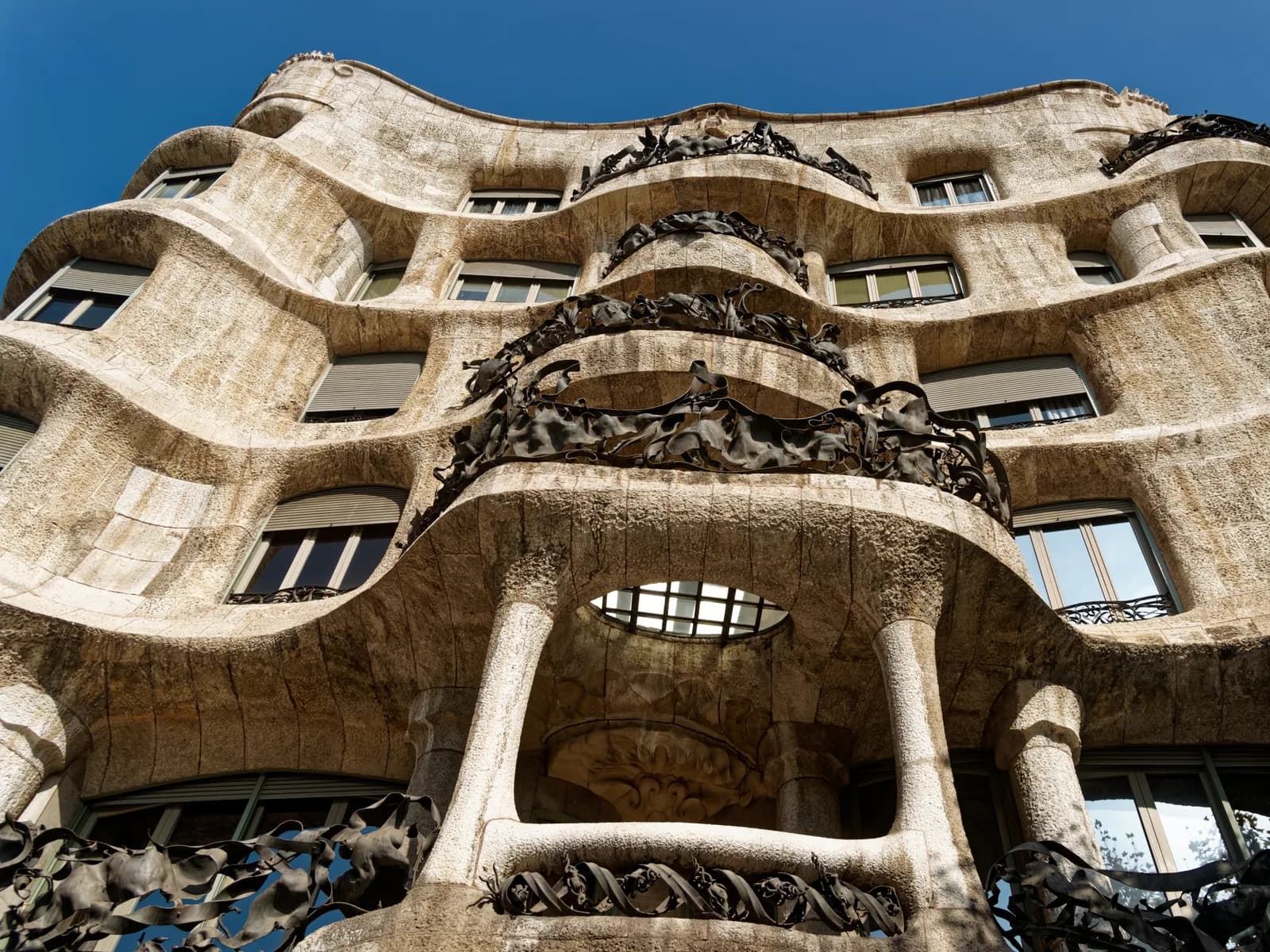 Casa Milà rooftop at night with audiovisual projections on the warrior chimneys