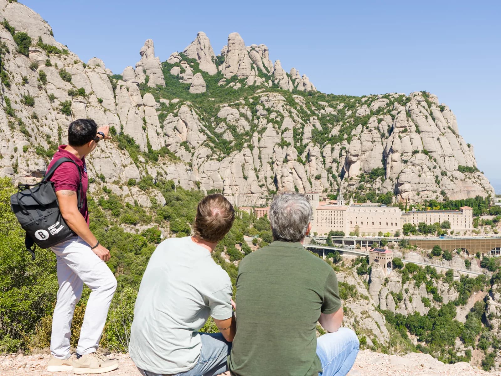 Group looking at the monastery and Montserrat's rock pinnacles