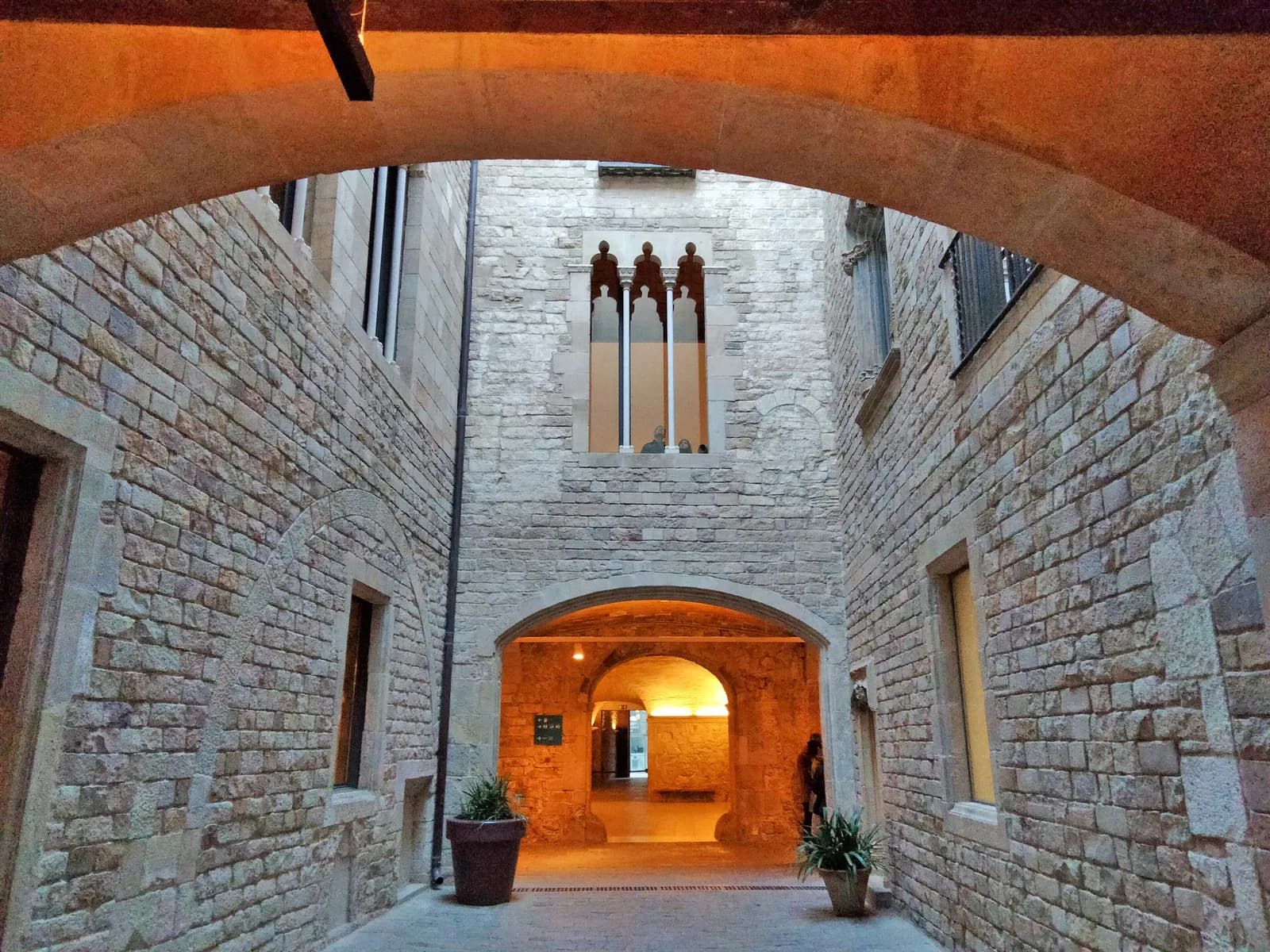 Gothic windows above an arched entrance at the Museu Picasso