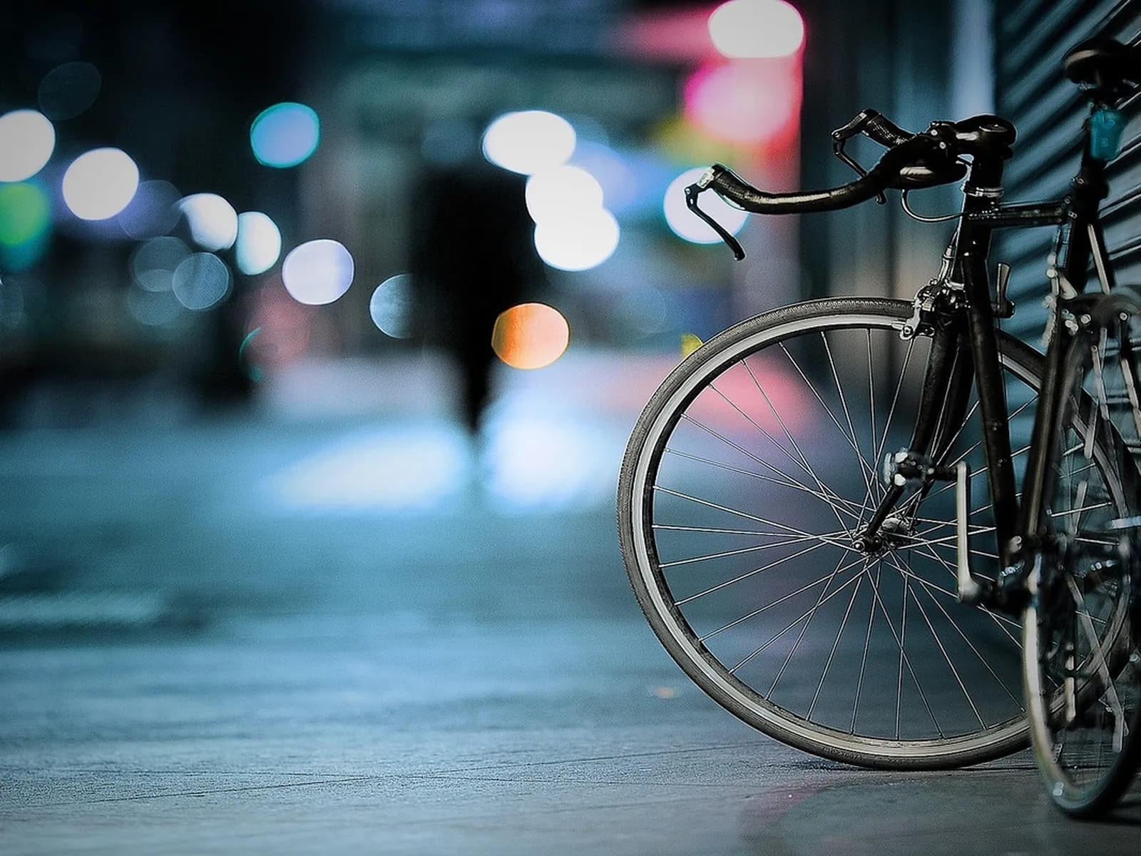 City bike parked on a street at dusk