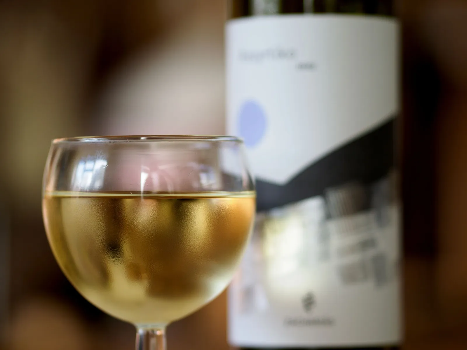 Glass of white txakoli