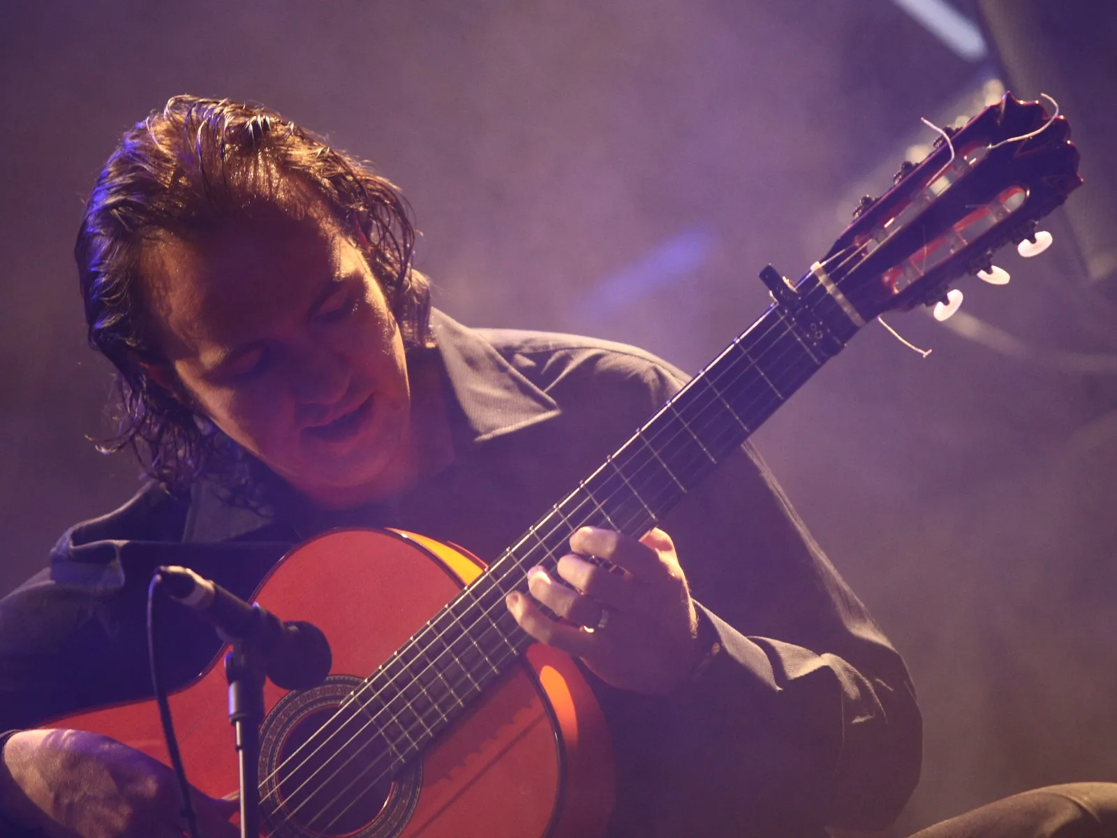 Flamenco guitarist playing on stage