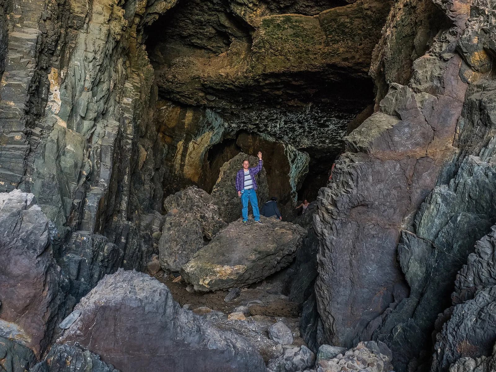 Visitor inside one of the Ajuy caves