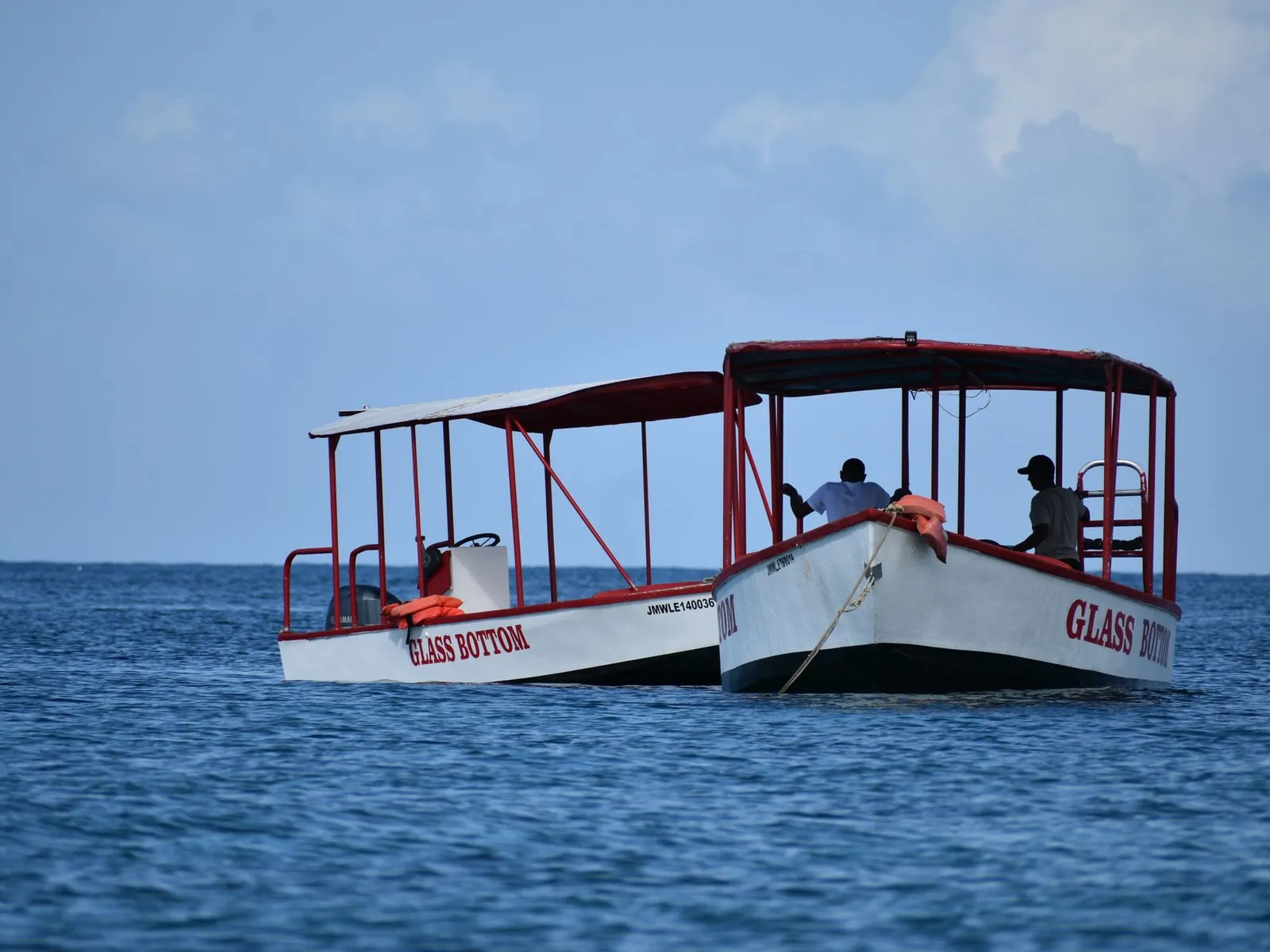 Glass-bottom boats anchored at sea