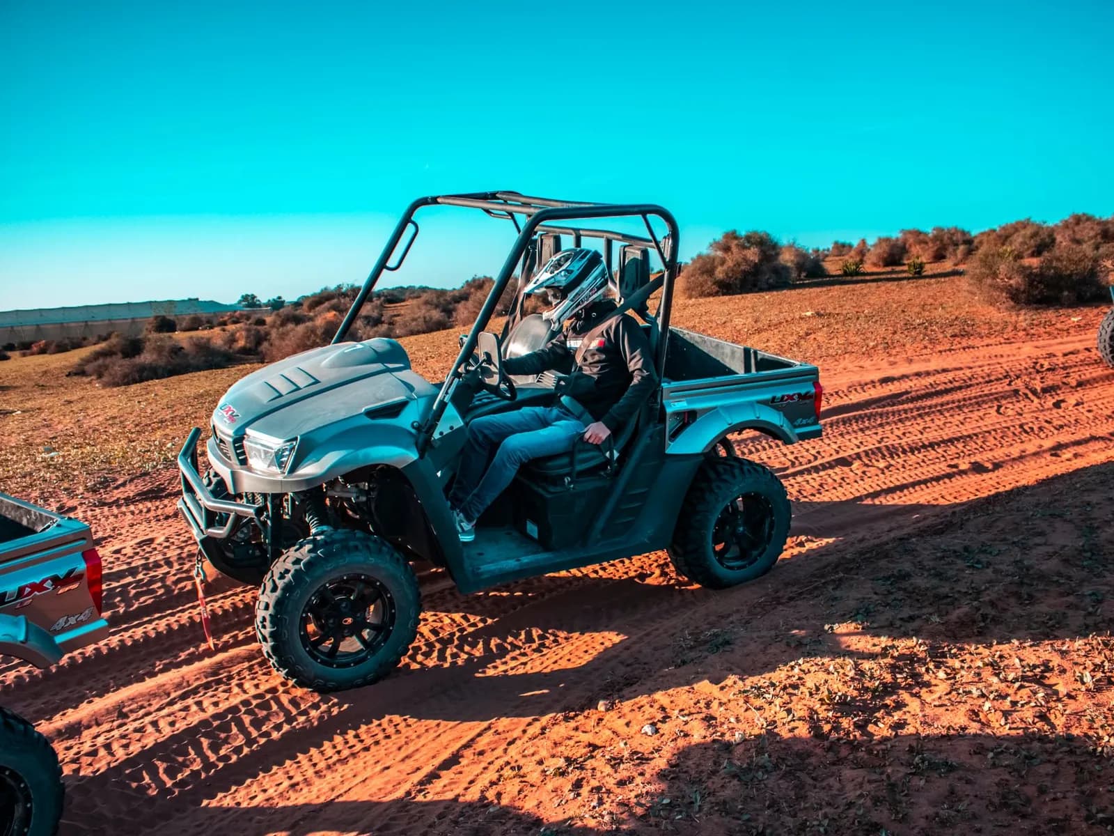 Buggy on a reddish dirt track