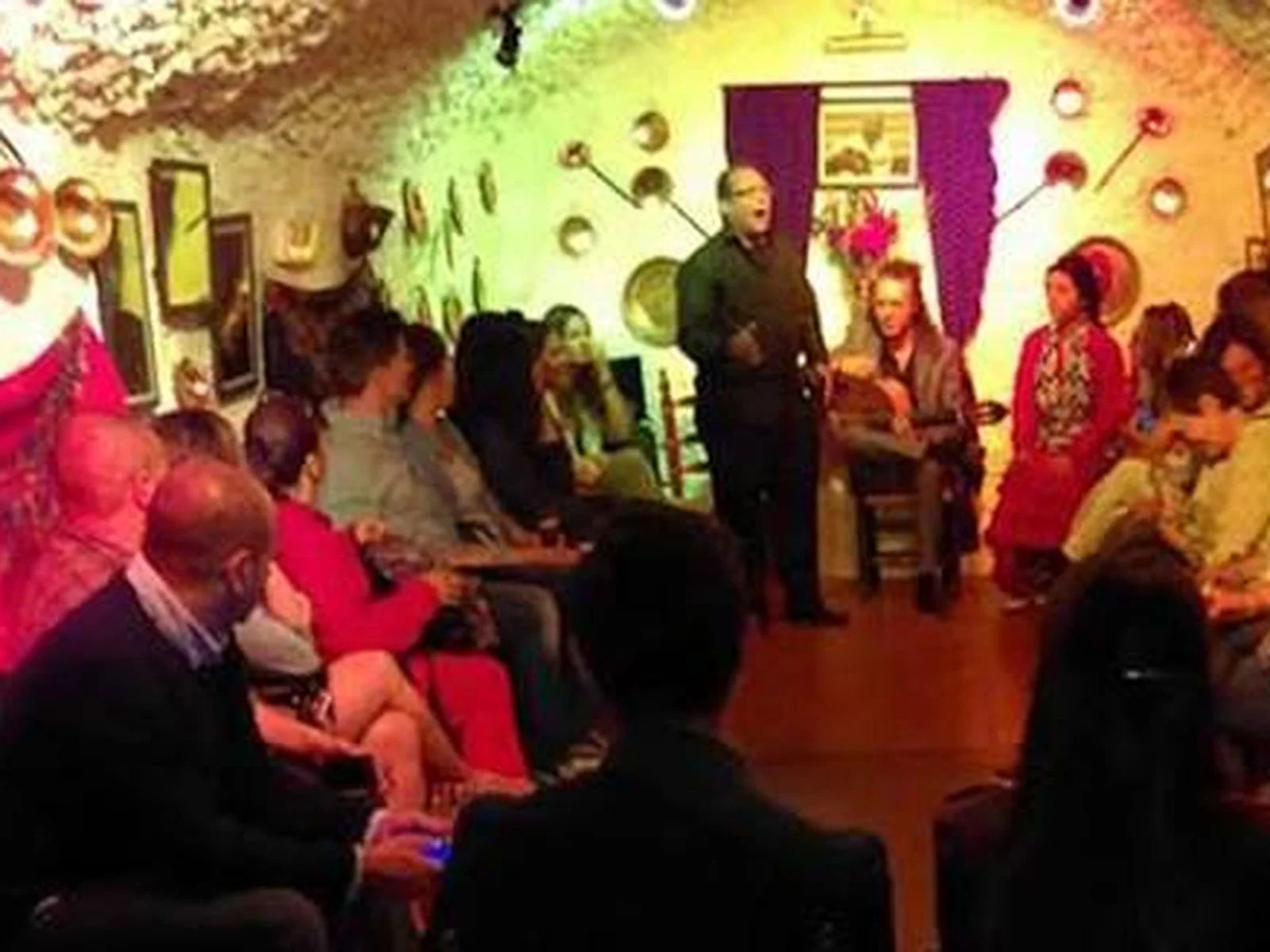 Flamenco zambra inside Cueva La Faraona, with the audience around the artists