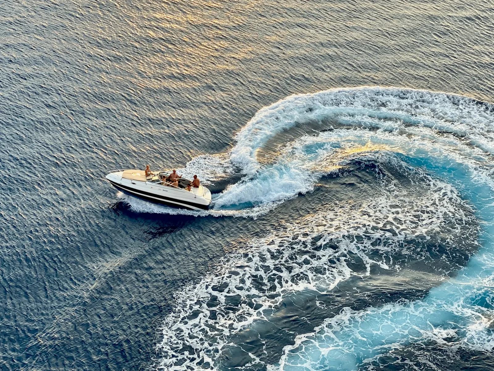 Motor boat cruising the Mediterranean and leaving a wake