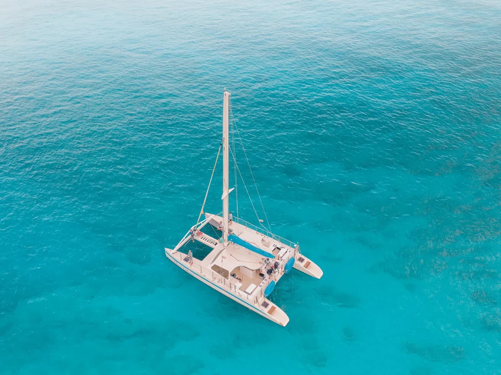 Catamaran seen from above over turquoise water