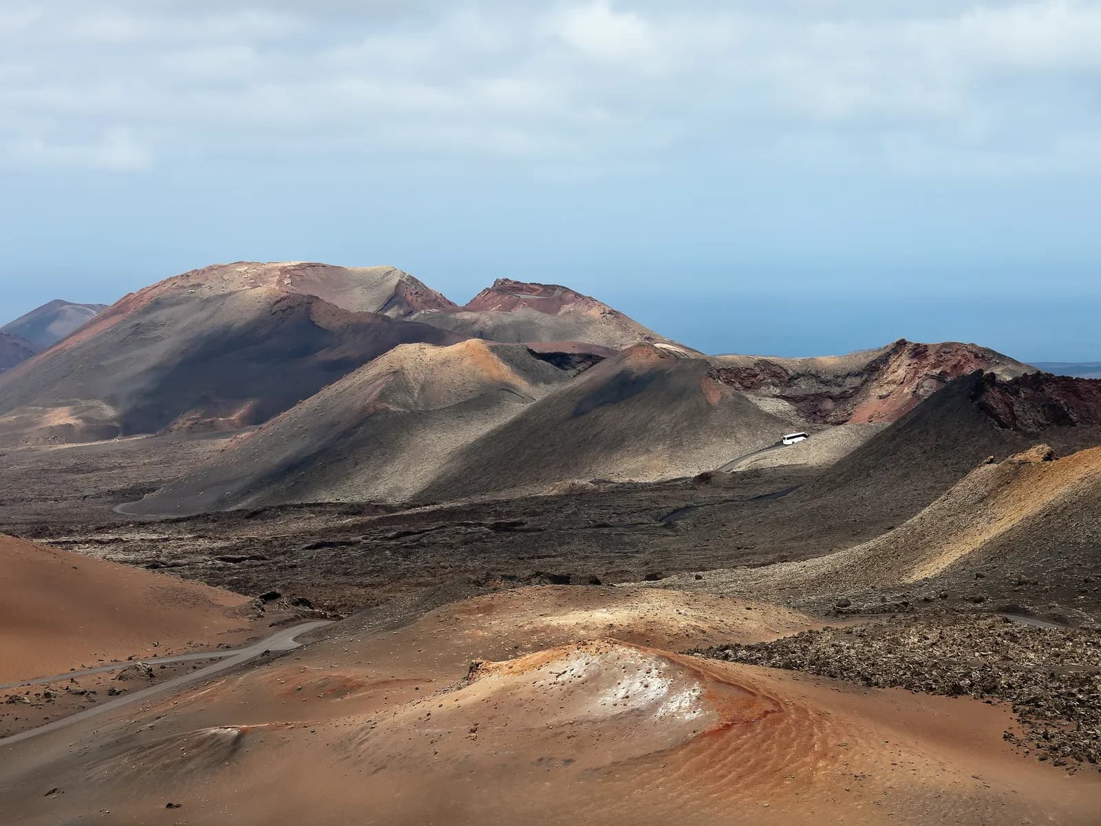 Red and ochre volcanic mountains in Timanfaya