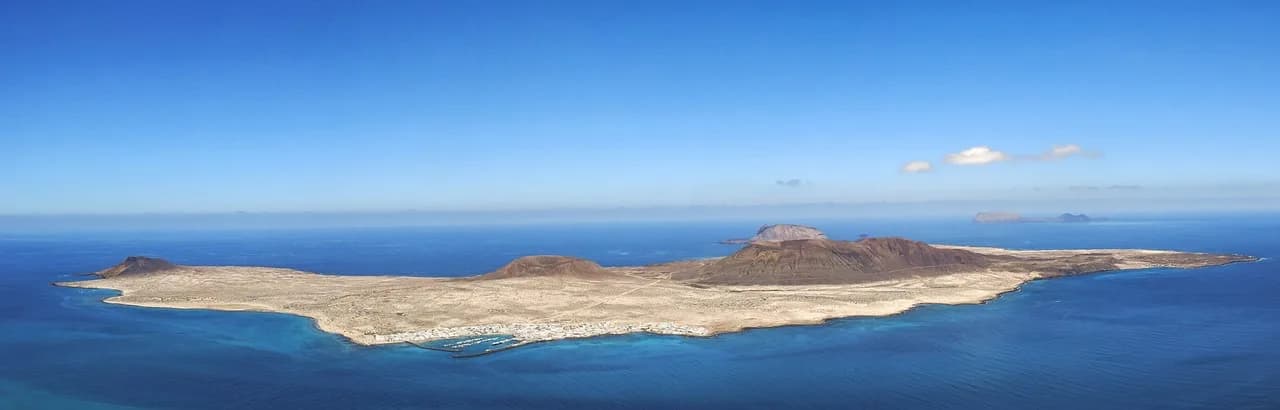 Reddish volcanic cones of the Fire Mountains in Timanfaya