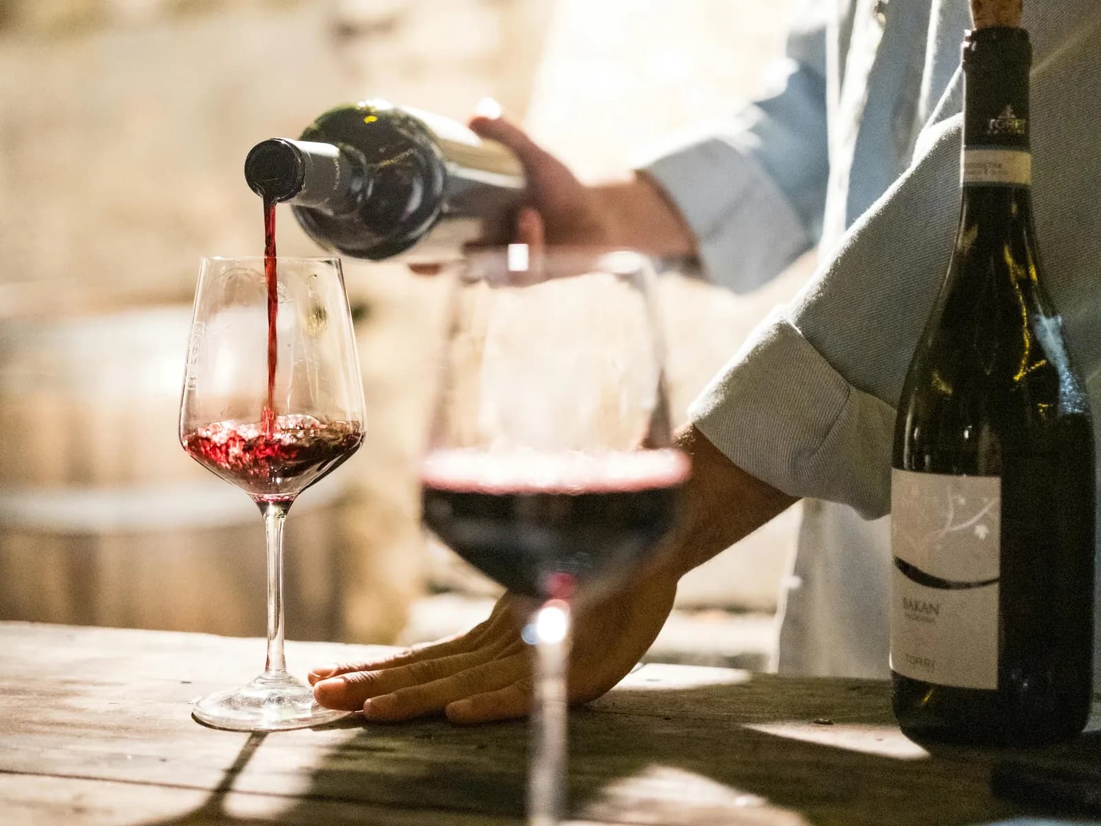Red wine being poured during the winery tasting