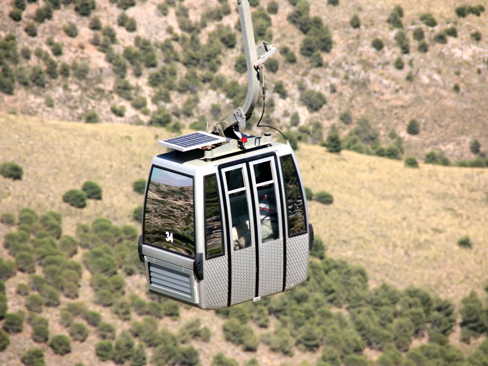 Benalmádena cable car cabin above the hillside