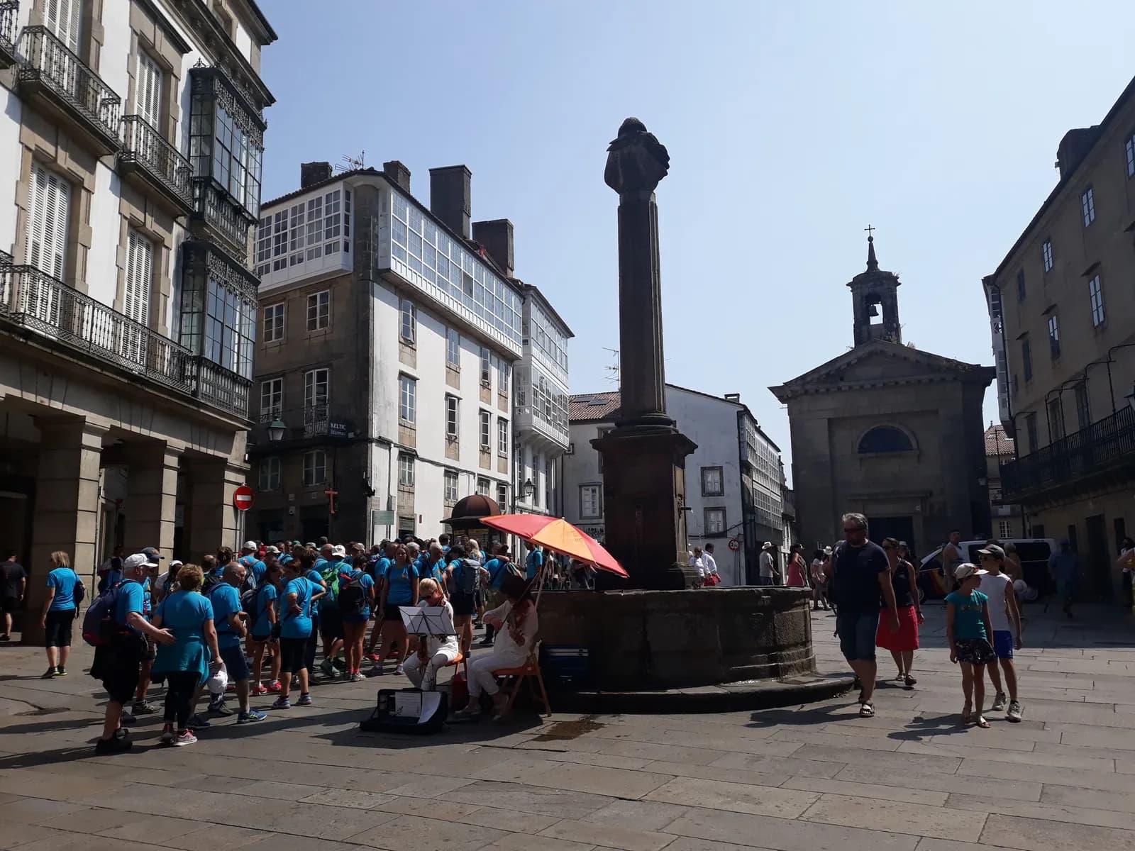 Guided group of visitors in a square in Santiago's old town