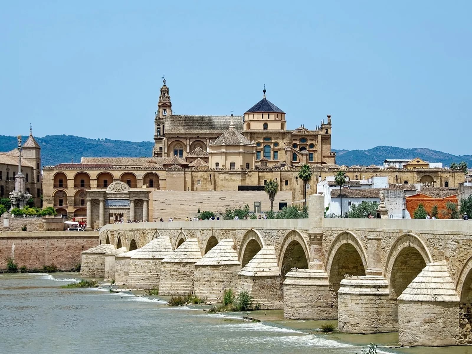 Red and white horseshoe arches with columns in the central nave of Córdoba's Mosque-Cathedral, a UNESCO World Heritage site.