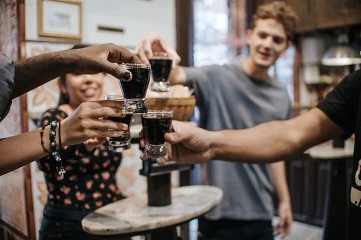 Group raising a toast in a Madrid tavern