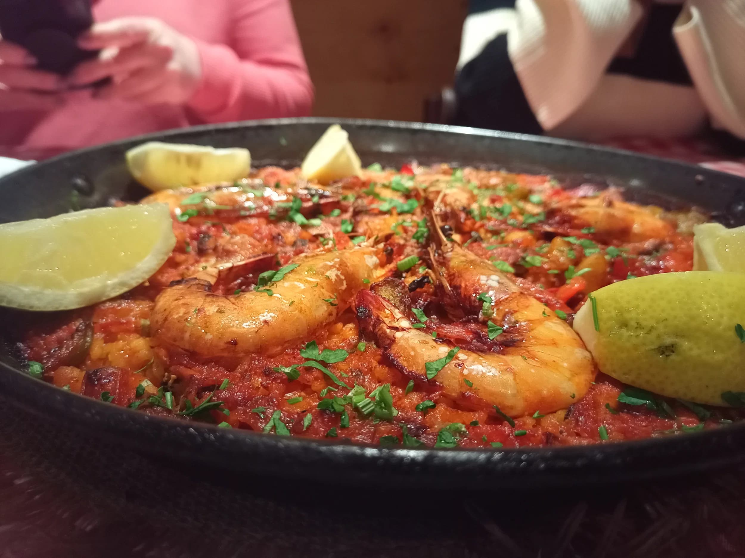 Paella with prawns and lemon