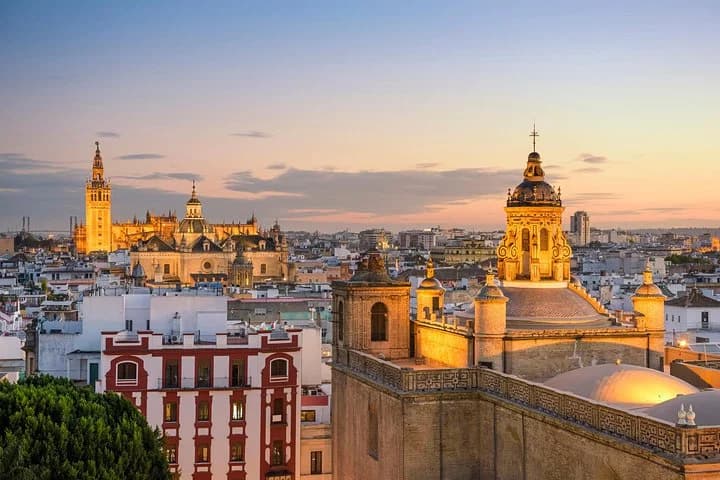 Seville rooftops with the Cathedral at sunset