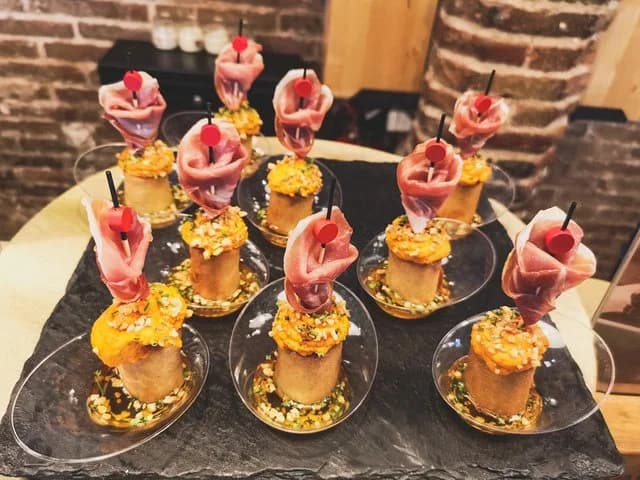 Ham and quail-egg pintxos served at a bar
